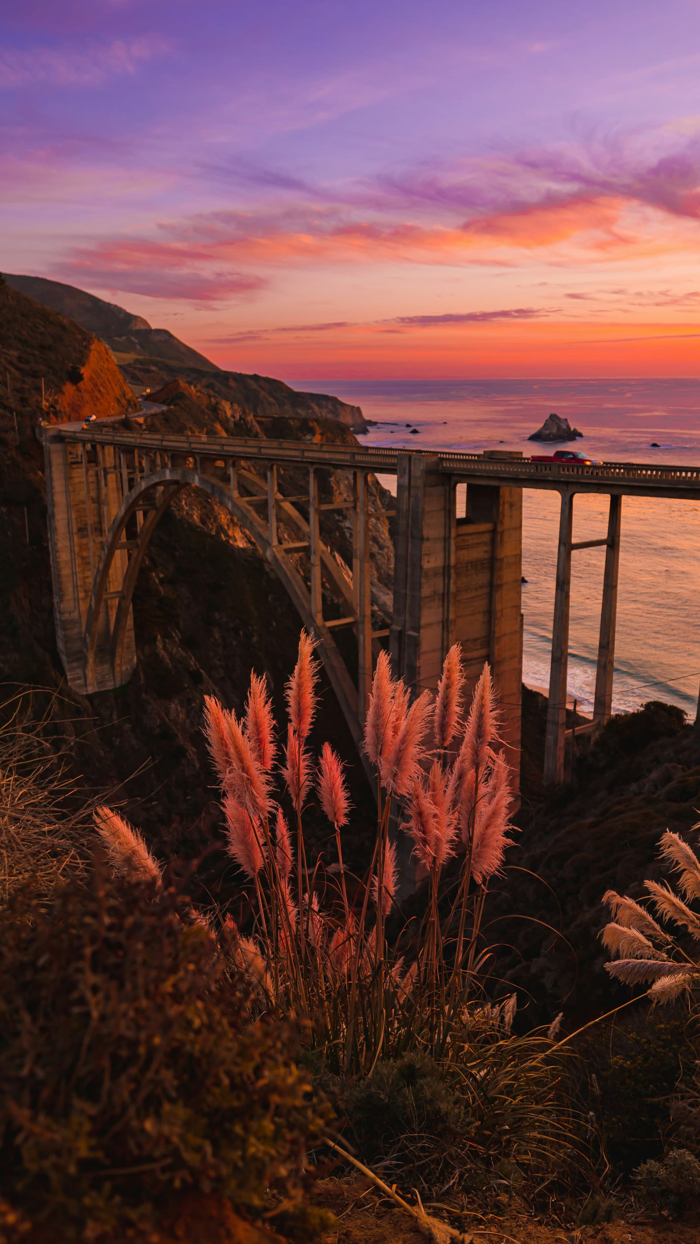 Coastal cliffside road at sunset